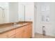 Bright bathroom featuring a granite vanity countertop and plantation shutters at 6120 9Th Avenue Ne Cir, Bradenton, FL 34212