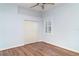 Bright bedroom with hardwood floors, closet, white walls, and a window with plantation shutters at 6120 9Th Avenue Ne Cir, Bradenton, FL 34212