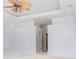 Bedroom with tray ceiling and fan with entrances to closets, bathroom and hallways at 6120 9Th Avenue Ne Cir, Bradenton, FL 34212