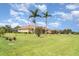 Lovely single-story home with well-manicured lawn and mature palm trees in a peaceful neighborhood at 6120 9Th Avenue Ne Cir, Bradenton, FL 34212