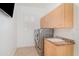 Laundry room with a new washer and dryer, cabinets and a sink at 6120 9Th Avenue Ne Cir, Bradenton, FL 34212