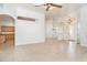 Open-plan living room with an entryway, tile flooring, and view of the kitchen at 6120 9Th Avenue Ne Cir, Bradenton, FL 34212