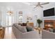 Bright living room with a fireplace and comfortable seating, creating a welcoming atmosphere at 6120 9Th Avenue Ne Cir, Bradenton, FL 34212