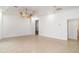 Spacious living room with ceiling fans, tile flooring, and neutral color palette at 6120 9Th Avenue Ne Cir, Bradenton, FL 34212