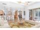 Inviting living room with elegant furnishings, neutral tones, and view of kitchen at 6120 9Th Avenue Ne Cir, Bradenton, FL 34212