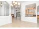 Open living space with fireplace, kitchen, and pool view beyond sliding glass doors at 6120 9Th Avenue Ne Cir, Bradenton, FL 34212