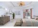 Bright main bedroom features tray ceilings, wood furnishings, and sliding glass doors with pool views at 6120 9Th Avenue Ne Cir, Bradenton, FL 34212