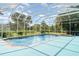 A refreshing pool with a screened enclosure surrounded by lush landscaping at 6120 9Th Avenue Ne Cir, Bradenton, FL 34212