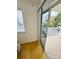 Balcony with view through sliding glass door looking out at the parking lot and building at 6931 Stones Throw N Cir # 5210, St Petersburg, FL 33710