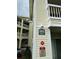 Apartment building exterior featuring 'no smoking' and 'fire safety' signs for a secure community at 6931 Stones Throw N Cir # 5210, St Petersburg, FL 33710