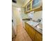 Kitchen featuring countertops, cabinetry, a sink, dishwasher, and a view into the living area at 6931 Stones Throw N Cir # 5210, St Petersburg, FL 33710