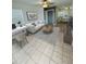Modern living room featuring bright, neutral colors and an open floor plan with desk and dining area at 6931 Stones Throw N Cir # 5210, St Petersburg, FL 33710