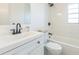 Clean bathroom with white vanity, new fixtures, and a shower-tub combo for a relaxing experience at 717 Fairmont Dr, Brandon, FL 33511