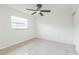 Empty bedroom with tile floors, ceiling fan, and natural light, ready to be personalized at 717 Fairmont Dr, Brandon, FL 33511