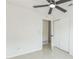 This bedroom has tile floors, a ceiling fan, and a closet for storage at 717 Fairmont Dr, Brandon, FL 33511