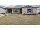 Charming single-story home with tan siding, brown shutters, and a well-maintained lawn at 717 Fairmont Dr, Brandon, FL 33511