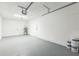 This garage features a large open space, multiple doors, and an electric garage door opener at 717 Fairmont Dr, Brandon, FL 33511
