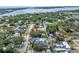 Aerial view of neighborhood with mature trees and landscaping. Subject property is indicated by red arrow at 7427 4Th N Ave, St Petersburg, FL 33710