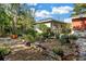 Serene backyard garden with lush greenery, potted plants, and charming decorative features at 7427 4Th N Ave, St Petersburg, FL 33710
