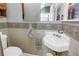 Charming bathroom with a vintage sink and decorative accents creates a cozy and inviting space at 7427 4Th N Ave, St Petersburg, FL 33710