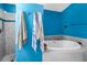 Luxurious bathroom features a soaking tub, separate shower, and elegant finishes, perfect for relaxation at 7427 4Th N Ave, St Petersburg, FL 33710