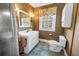 Cozy bathroom with a tiled shower, toilet, sink, and decorative fixtures at 7427 4Th N Ave, St Petersburg, FL 33710