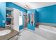 Stylish bathroom featuring a soaking tub, shower, and modern fixtures for a spa-like experience at 7427 4Th N Ave, St Petersburg, FL 33710
