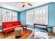 Cozy bedroom featuring natural light, a futon, and light blue walls at 7427 4Th N Ave, St Petersburg, FL 33710
