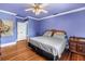 Spacious bedroom featuring hardwood floors and ample natural light creating a serene and comfortable atmosphere at 7427 4Th N Ave, St Petersburg, FL 33710