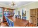Elegant dining room with wooden table, chandelier, and a view into the kitchen at 7427 4Th N Ave, St Petersburg, FL 33710