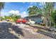 Long driveway leading to a detached garage with parking space for multiple vehicles at 7427 4Th N Ave, St Petersburg, FL 33710