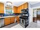 Well-equipped kitchen with stainless steel appliances and wood cabinetry at 7427 4Th N Ave, St Petersburg, FL 33710