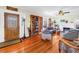 Inviting living room with hardwood floors, a fireplace, and comfortable seating for relaxation at 7427 4Th N Ave, St Petersburg, FL 33710