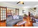 Bright living room boasts hardwood floors, stylish sofas, and classic design at 7427 4Th N Ave, St Petersburg, FL 33710