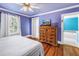 Inviting main bedroom with hardwood floors, offering comfort and style for relaxation and rest at 7427 4Th N Ave, St Petersburg, FL 33710