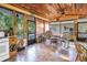 Enclosed sunroom with tile floors and multiple rocking chairs, offering a relaxing space at 7427 4Th N Ave, St Petersburg, FL 33710