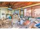 Spacious sunroom with tile floors, a wooden ceiling, a TV, and plenty of natural light at 7427 4Th N Ave, St Petersburg, FL 33710