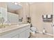 Bathroom featuring white vanity, toilet, and neutral-colored tile floor at 10764 70Th Ave # 6210, Seminole, FL 33772