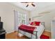 Bedroom featuring a bed, window, and modern furnishings at 10764 70Th Ave # 6210, Seminole, FL 33772