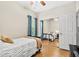 The bedroom has a mirrored closet, ceiling fan, and natural light at 10764 70Th Ave # 6210, Seminole, FL 33772