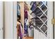 Well-organized closet with clothes, shelves, and an expandable drying rack at 10764 70Th Ave # 6210, Seminole, FL 33772