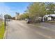 Gated entrance to the community for increased security and privacy, surrounded by lush landscaping at 10764 70Th Ave # 6210, Seminole, FL 33772