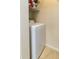 A front-load washer with cleaning supplies stored above it at 10764 70Th Ave # 6210, Seminole, FL 33772