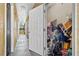 Hallway access to a storage area, suitable for storing personal items and seasonal decorations at 10764 70Th Ave # 6210, Seminole, FL 33772