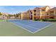 Well-maintained community tennis court surrounded by greenery, offering an active lifestyle for residents at 10764 70Th Ave # 6210, Seminole, FL 33772