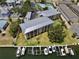 Aerial view of a waterfront condominium complex with boat docks at 1125 Pinellas Bayway S # 103, Tierra Verde, FL 33715