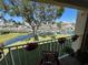 Relax on this beautiful balcony overlooking the marina with lush greenery and colorful potted plants, perfect for enjoying the scenic views at 1125 Pinellas Bayway S # 103, Tierra Verde, FL 33715