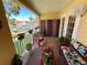 This outdoor space provides comfortable seating and vibrant decor to enjoy stunning views of the adjacent marina and coastal landscape at 1125 Pinellas Bayway S # 103, Tierra Verde, FL 33715