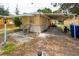 Spacious backyard with covered parking and a small patio area at 1144 7Th Nw St, Largo, FL 33770