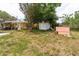 Spacious backyard featuring a shed, offering ample space for outdoor activities and storage at 1144 7Th Nw St, Largo, FL 33770